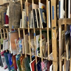 paintings stored on a rack