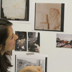 student looking at art
