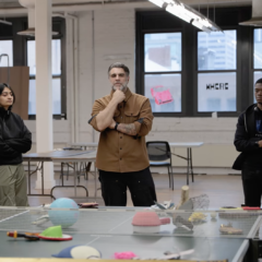 Graduate leading his undergraduate class in critique